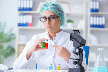 Female scientist researcher conducting an experiment in a labora