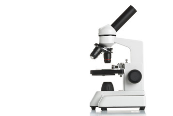 White microscope on table - obrazy, fototapety, plakaty