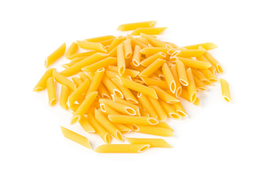 Heap of dried, raw, uncooked penne pasta