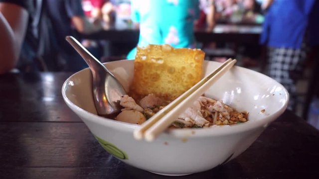 Eating noodle at restaurant in Thailand