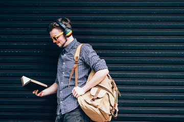 Closeup on a man holding a bible at shopping mall, believe concept