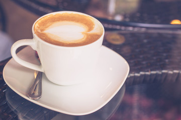 a cup of Capuchino coffee