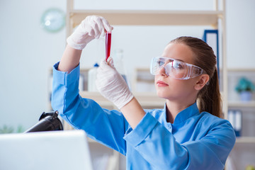Female scientist researcher conducting an experiment in a labora