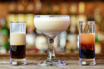 a variety of cocktails in a nightclub