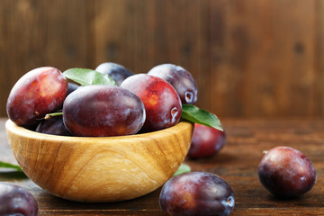 ripe plums in a bowl