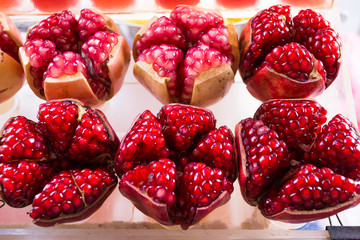 Closeup pomegranate and sweet oranges backgrounds,Bottled fruit,Healthy drinking water