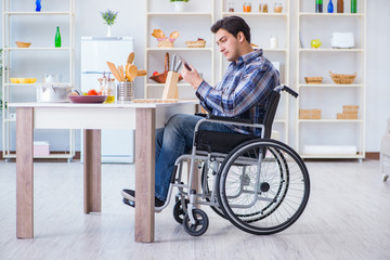 Disabled young man husband working in kitchen