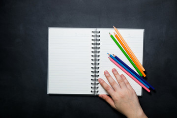 School equipment and supplies for work on a black background., Education concept., Top view.