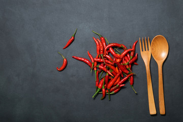 Red chilli on black background using fresh red., It has spicy., food concept., Top view 