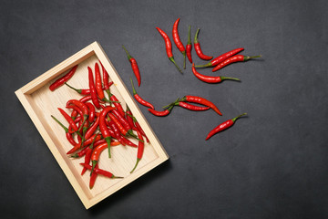 Red chilli on black background using fresh red., It has spicy., food concept., Top view 