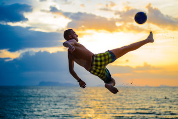 Kicking a ball. Silhouette of a man on a beach