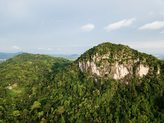 Aerial view, tropical forest on the mountain with blue sky