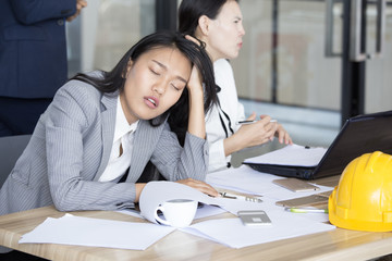 Asian Woman Sleep while Meeting with team. Woman ignor for meeting with team.