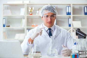 Young researcher scientist doing a water test contamination expe