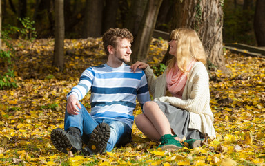 couple relaxing in autumn park