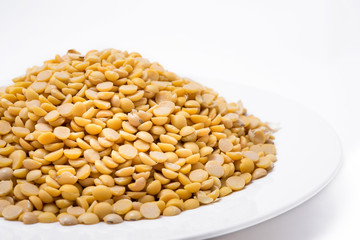 Dry yellow split peas isolated on white background (Soybean halves)