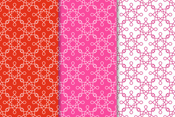 Geometric backgrounds. Set of red and pink seamless patterns