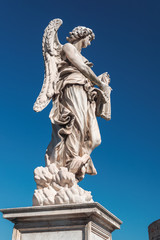 Fototapeta na wymiar Angel with whips on the bridge of Saint Angel in Rome