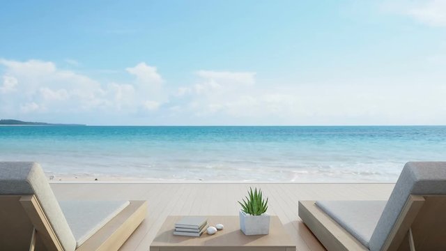 Sea view terrace and beds in modern luxury beach house with blue sky background, Lounge chairs on wooden deck at vacation home or hotel - 3d rendering of tourist resort