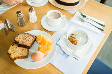 morning breakfast, muesli with yoghurt, eggs