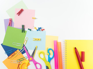 Note all colorful paper with paperclip and notepad with scissors and notepad, object concept on white background