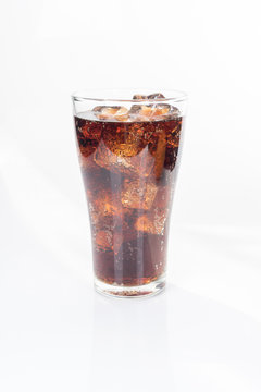 Full glass of soft drink, isolated on white background