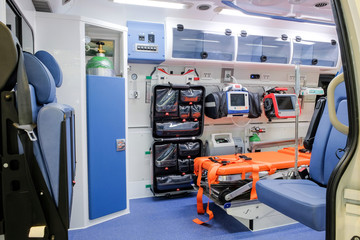 Inside an ambulance with medical equipment for helping patients before delivery to the hospital. © CHIRADECH