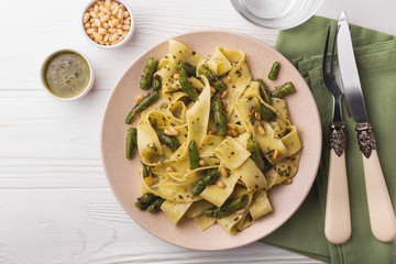 Vegetarian pappardelle pasta with green bean, pesto, pine nuts