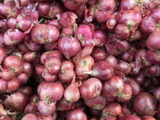 Red onions in plenty on display at local farmer's Thailand Market. Big Red Onions Background, Eleutherine bulbosa vegetable thai food.