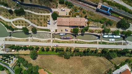 Aerial top view of Fonserannes locks on canal du Midi from above, unesco heritage landmark in France  