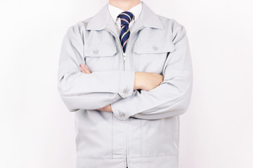 作業着 男性 ネクタイ ポーズ 腕組