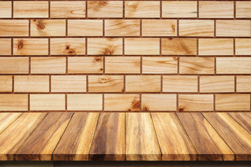 Empty top of wooden table on wood background.
