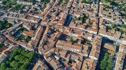 Aerial top view of residential area houses roofs and streets from above, old medieval town background
