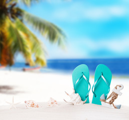 Fototapeta na wymiar Summer concept, flip-flops, summer accessories on summer beach