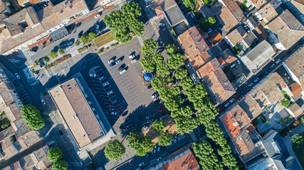 Aerial top view of residential area houses roofs and streets from above, old medieval town background
