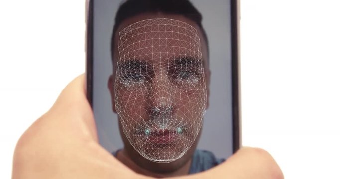 Smart phone facial recognition concept as male hold mobile with his fave on display and scanned using face id software