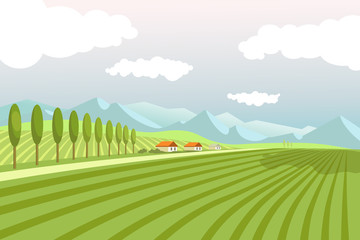 Natural landscape with wide plowed fields and high mountains