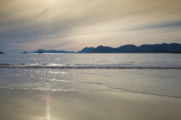 Sunset on the empty Roervik beach, Norway