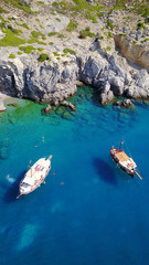 August 2017: Aerial drone photo of paradise beach of Traganou with small caves and turquoise clear waters, Rhodes island, Dodecanese, Aegean, Greece