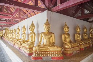 Golden buddha statue in thailand.sitting buddha statue spiritual background in phitsanulok province thailand