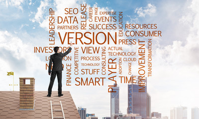 Young businessman standing on house roof and writing leadership skill concept. Mixed media