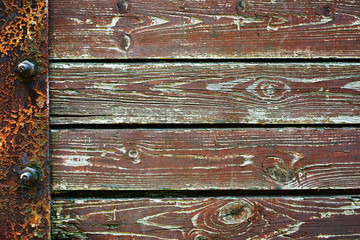 Wooden background from old plank boards with iron fastening, horizontal arrangement in a row