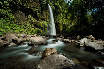 Fototapeta premium Sendang Gile waterfall is a stunning waterfall on Lombok, Indonesia. Long exposure photography.