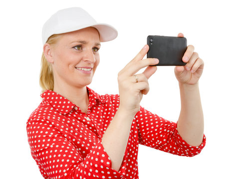 smiling woman taking picture with smartphone camera