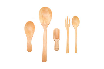 Wooden spoon, fork, scoop, and teaspoon on a white background.