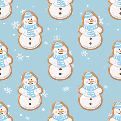 Ginger cookies seamless pattern.Christmas gingerbread seamless pattern. Ginger cookies on light blue background with snowflakes.