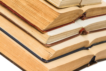 Open old book on white background