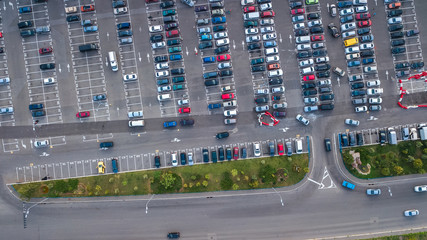 Aerial top view of parking lot with many cars from above, transportation and urban concept

