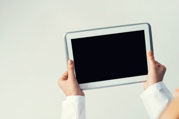 Close of female doctor hands working with tablet pc computer