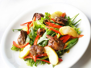 Warm salad with chicken liver, greens arugula,red pepper and balsamic dressing